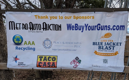 Sponsor banner at the LISD FFA Blue Jacket Blast sporting clays tournament thanking community supporters including WeBuyYourGuns.com